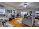 Bright living room with hardwood floors, comfy couch, and a workspace at 4105 South Fork Ave, Hickory, NC 28602