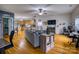 Open living room features hardwood floors, a gray couch, and a view into the kitchen at 4105 South Fork Ave, Hickory, NC 28602