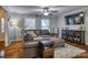 Living room featuring hardwood floors, comfy couch, and large TV at 4105 South Fork Ave, Hickory, NC 28602