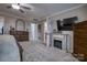 Main bedroom with fireplace, TV and large windows at 4105 South Fork Ave, Hickory, NC 28602