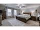 Main bedroom with large bed, wood furniture, and carpet at 4105 South Fork Ave, Hickory, NC 28602