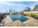 Relaxing inground pool with safety cover and surrounding patio at 4105 South Fork Ave, Hickory, NC 28602