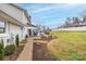 Pathway leads to the back patio, showcasing the home's side and partially visible pool at 4105 South Fork Ave, Hickory, NC 28602