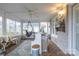 Relaxing sunroom with hanging chair and brick flooring at 4105 South Fork Ave, Hickory, NC 28602