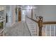 Upstairs hallway with carpeted floors and wooden staircase at 4105 South Fork Ave, Hickory, NC 28602