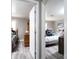 Hallway view of two bedrooms with light grey walls at 4405 Tillman Rd, Charlotte, NC 28208