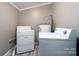 Laundry room with washer, dryer and water heater at 4405 Tillman Rd, Charlotte, NC 28208