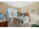 Bright bedroom with a ceiling fan, a comfortable bed, and an antique dresser at 5021 Redwood Grove Trl # 86, Lancaster, SC 29720