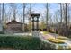 Community courtyard features a clock tower and stone pathway at 5021 Redwood Grove Trl # 86, Lancaster, SC 29720