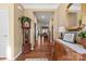 Bright entryway with hardwood floors, a grandfather clock, and antique furniture at 5021 Redwood Grove Trl # 86, Lancaster, SC 29720