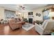 Relaxing living room with fireplace and hardwood floors at 5021 Redwood Grove Trl # 86, Lancaster, SC 29720