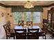 Bright dining area with large windows and wooden table for six at 506 Birmingham Ct, Rock Hill, SC 29732