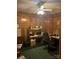 Home office with wood-paneled walls, desk, and chair at 506 Birmingham Ct, Rock Hill, SC 29732