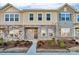 Two-story townhome with stone and siding accents, landscaping, and a walkway at 638 Sagecroft Ln, Indian Trail, NC 28079