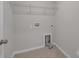 Convenient laundry room with ample shelving at 638 Sagecroft Ln, Indian Trail, NC 28079