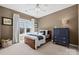 Charming bedroom with a wooden bed frame and blue dresser at 7005 Shadow Rock Ct, Matthews, NC 28104