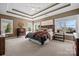 Spacious bedroom with a wooden bed frame and neutral decor at 7005 Shadow Rock Ct, Matthews, NC 28104