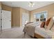 Bedroom with a double door closet and backyard view at 7005 Shadow Rock Ct, Matthews, NC 28104