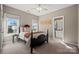 Cozy bedroom with a black bed frame and a view to a small bathroom at 7005 Shadow Rock Ct, Matthews, NC 28104