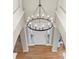 Large chandelier in the two-story entryway with hardwood floor at 7005 Shadow Rock Ct, Matthews, NC 28104