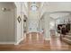 Bright two-story entryway with hardwood floors and views to living room at 7005 Shadow Rock Ct, Matthews, NC 28104