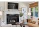 Elegant fireplace with a modern mantel and a large TV above at 7005 Shadow Rock Ct, Matthews, NC 28104