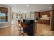 Kitchen with island, breakfast nook, and hardwood floors at 7005 Shadow Rock Ct, Matthews, NC 28104