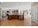 Kitchen with island, stainless steel appliances, and hardwood floors at 7005 Shadow Rock Ct, Matthews, NC 28104