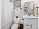 Clean and modern bathroom with white vanity, gold accents, and shower/tub combo at 7324 Swans Run Rd, Charlotte, NC 28226