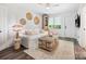 Cozy living room featuring a white couch, wooden coffee table, and area rug at 7324 Swans Run Rd, Charlotte, NC 28226