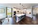 Modern kitchen with white cabinets, island, and stainless steel appliances at 7657 Bainbridge Rd, Sherrills Ford, NC 28673