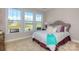 Cozy bedroom with a tufted headboard and plenty of natural light at 7673 Bainbridge Rd, Sherrills Ford, NC 28673