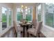 Bright breakfast nook with a table and four chairs, near French doors at 7673 Bainbridge Rd, Sherrills Ford, NC 28673