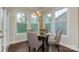 Bright breakfast nook with a table and four chairs, near French doors at 7673 Bainbridge Rd, Sherrills Ford, NC 28673