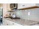 Modern kitchen features granite countertops and white cabinets at 7673 Bainbridge Rd, Sherrills Ford, NC 28673