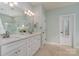 Elegant bathroom with double vanity and soaking tub at 7734 Garnkirk Dr, Huntersville, NC 28078