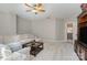 Bright bonus room with L-shaped sectional sofa at 7734 Garnkirk Dr, Huntersville, NC 28078