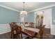 Formal dining room with hardwood floors and chandelier at 7734 Garnkirk Dr, Huntersville, NC 28078