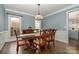 Formal dining room with hardwood floors and view of kitchen at 7734 Garnkirk Dr, Huntersville, NC 28078