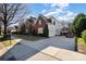 Two-car garage with a large driveway at 7734 Garnkirk Dr, Huntersville, NC 28078