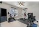 Bright home gym with Peloton bike and weight machine at 7734 Garnkirk Dr, Huntersville, NC 28078