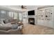 Living room features a fireplace and built-in shelving at 7734 Garnkirk Dr, Huntersville, NC 28078