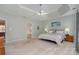 Spacious main bedroom with tray ceiling and access to en-suite bathroom at 7734 Garnkirk Dr, Huntersville, NC 28078