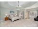 Main bedroom with large windows and a ceiling fan at 7734 Garnkirk Dr, Huntersville, NC 28078