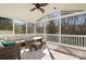 Relaxing screened porch with wicker furniture at 7734 Garnkirk Dr, Huntersville, NC 28078