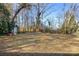 Large backyard with shed and riding mower at 7933 Cherry Point Dr, Denver, NC 28037