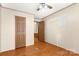 Bright bedroom with ceiling fan and wood flooring at 7933 Cherry Point Dr, Denver, NC 28037