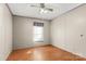 Well-lit bedroom with ceiling fan and wood floor at 7933 Cherry Point Dr, Denver, NC 28037