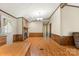 Dining area with wood laminate flooring and stone fireplace at 7933 Cherry Point Dr, Denver, NC 28037