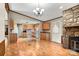 Open dining area with laminate floor and stone fireplace at 7933 Cherry Point Dr, Denver, NC 28037